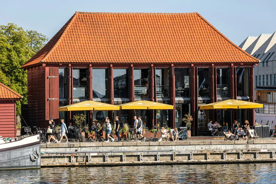 People and bicycles outside a Copenhagen waterfront bakery